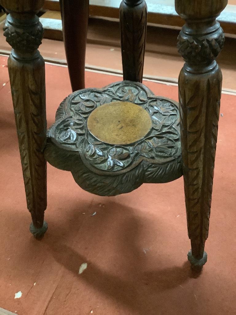 An early 20th century Indian carved hardwood occasional table, width 32cm height 54cm